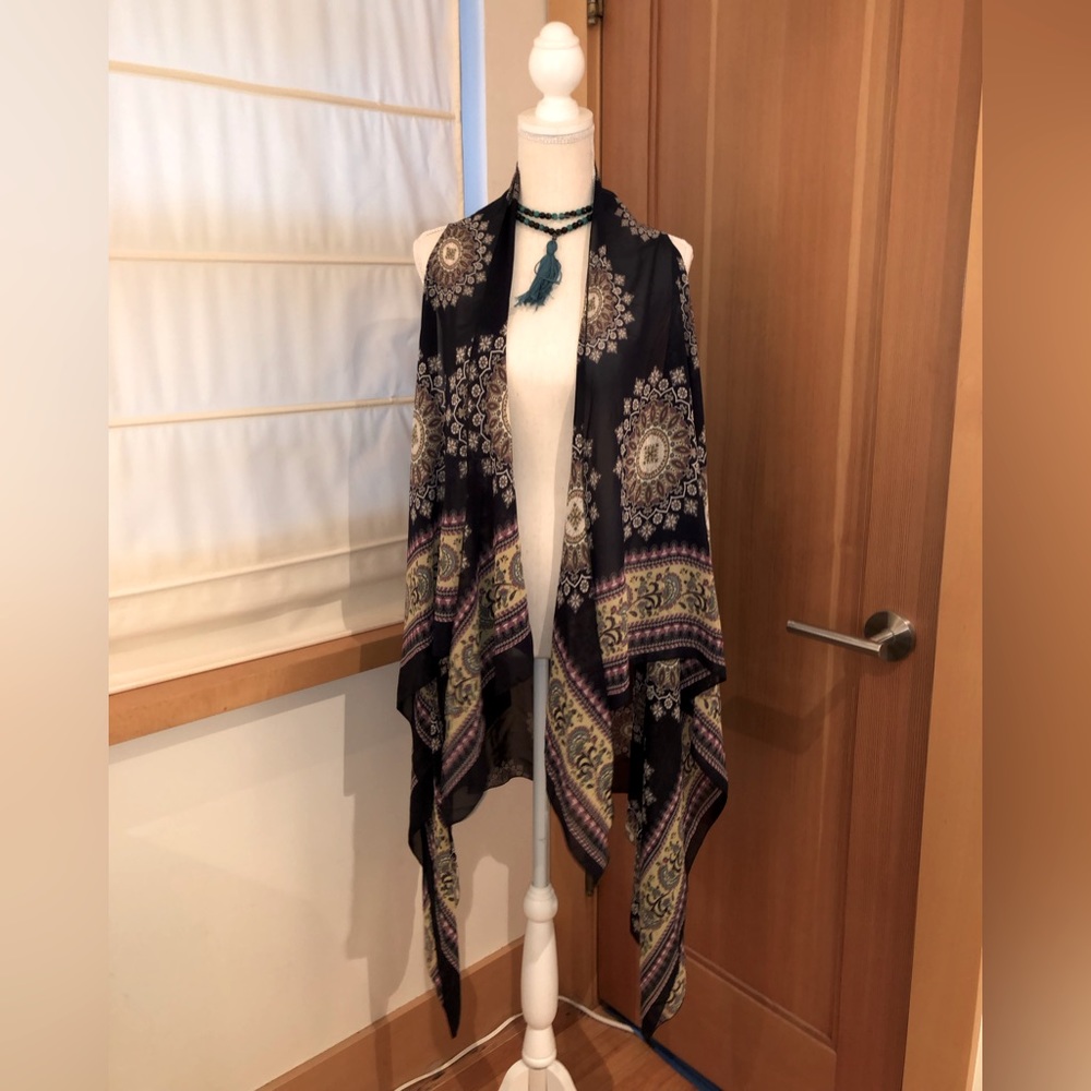 Sleeveless lightweight colorful shawl. Great for layering .